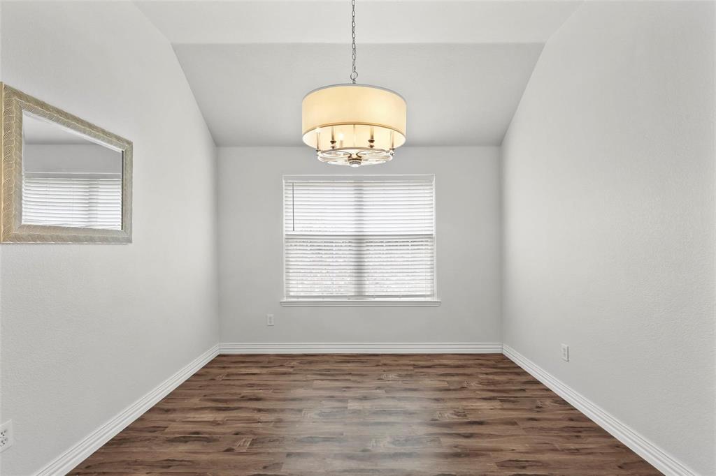 5961 Cheyenne Way Frisco, TX 75034 - Photo 6 of 33 Room featuring wood-finish flooring, a contemporary drum chandelier, and a window with horizontal blinds