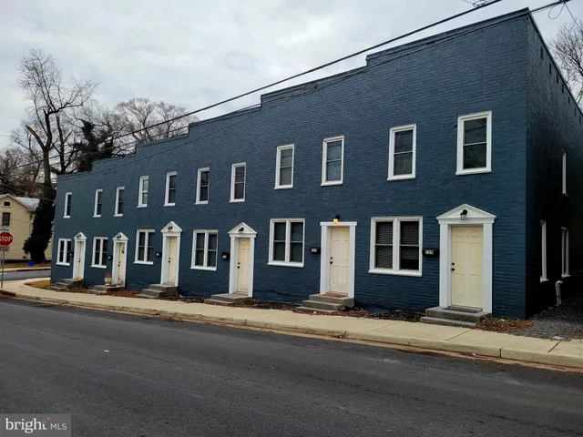 a front view of a building with a road