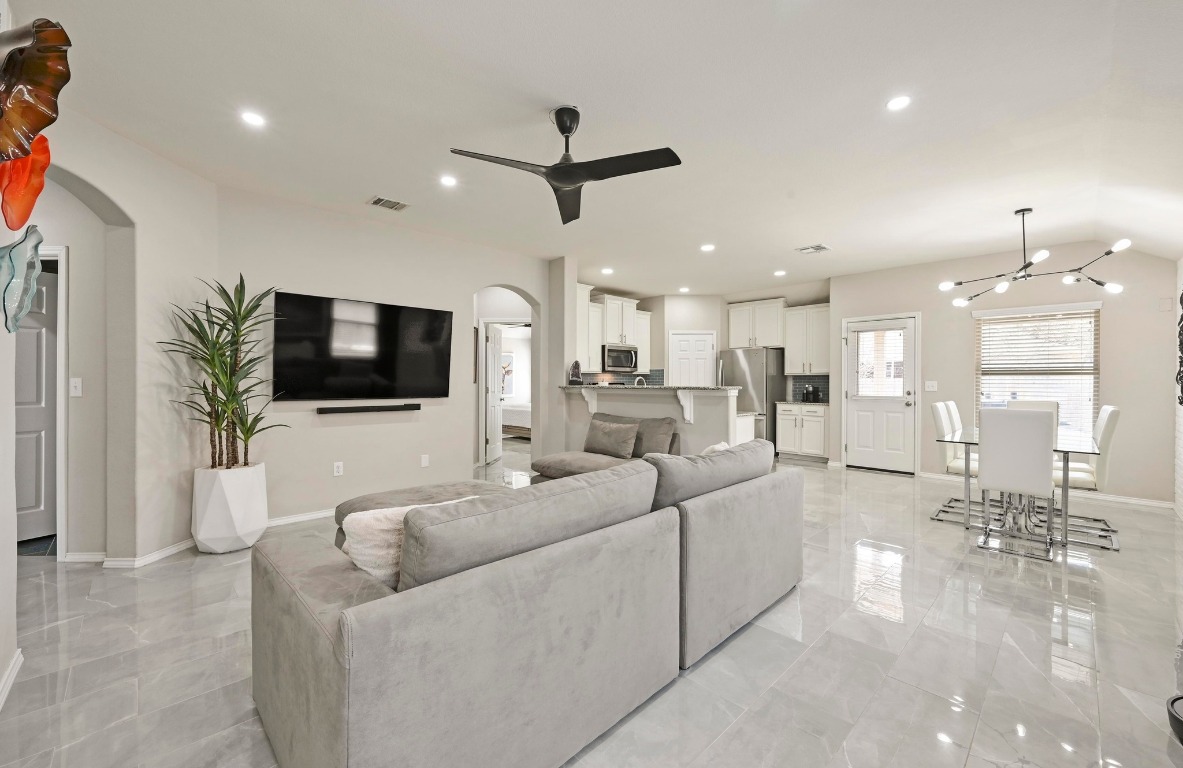 249 Noddy Road Buda, TX 78610 - Photo 1 of 1 a living room with furniture and a flat screen tv