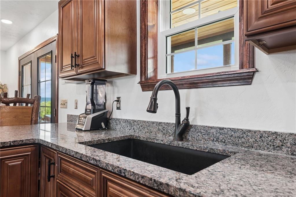 394 Mountain View Road New Florence, PA 15944 - Photo 14 of 37 a kitchen with granite countertop a sink and a stove