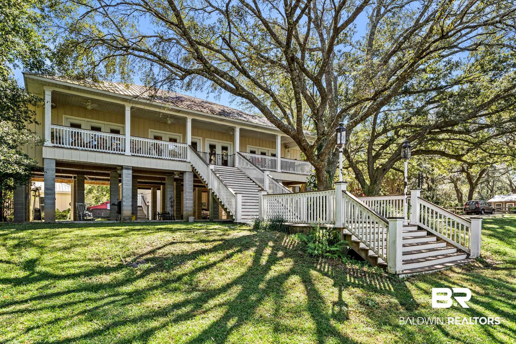 17375 River Road Summerdale, AL 36580 - Photo 1 of 47 Expansive covered porch looking out onto the river
