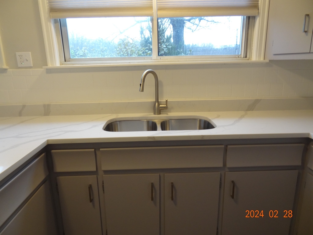 131 Worcester-Providence Turnpike, Unit 1 Millbury, MA 01527 - Photo 14 of 18 a close view of sink and tap