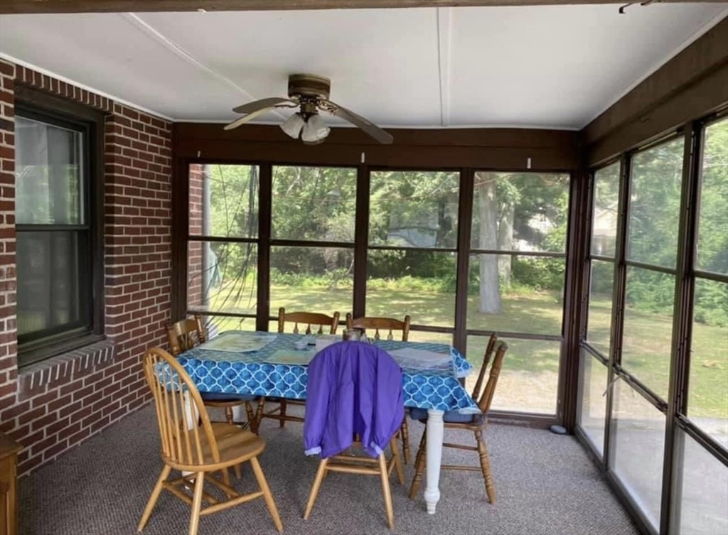 131 Worcester-Providence Turnpike, Unit 1 Millbury, MA 01527 - Photo 16 of 18 a view of a dining room with furniture window and outside view
