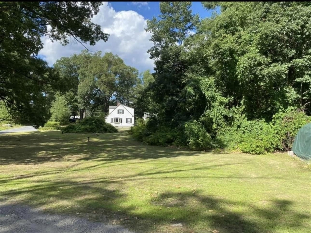 131 Worcester-Providence Turnpike, Unit 1 Millbury, MA 01527 - Photo 18 of 18 a view of a swimming pool with an outdoor space and seating area