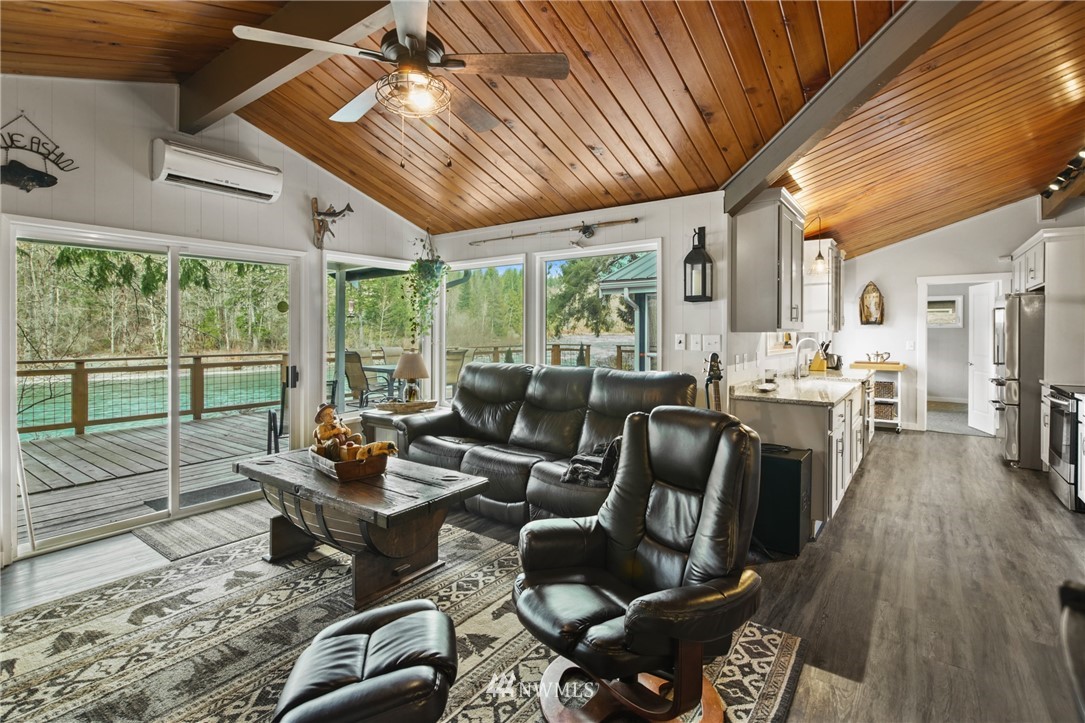 43825 Fir Road Gold Bar, WA 98251 - Photo 11 of 35 a living room with furniture fireplace and large windows