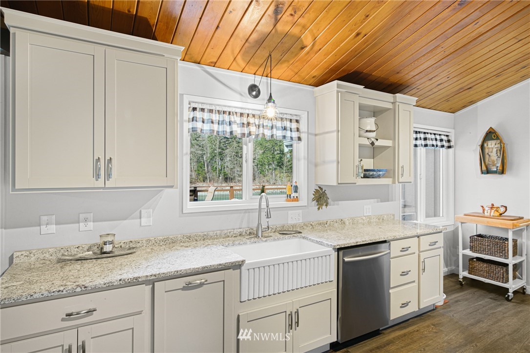 43825 Fir Road Gold Bar, WA 98251 - Photo 14 of 35 a kitchen with granite countertop cabinets stainless steel appliances a sink and a window