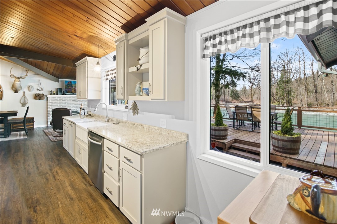 43825 Fir Road Gold Bar, WA 98251 - Photo 16 of 35 a kitchen with stainless steel appliances granite countertop a stove and a wooden floors