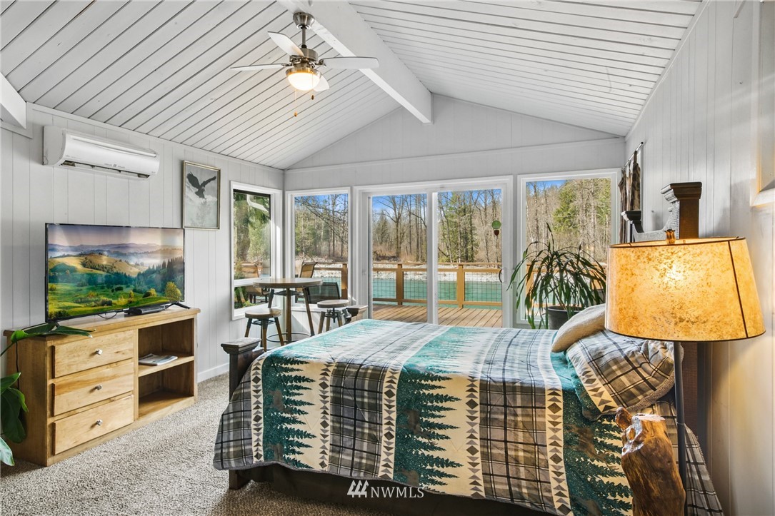 43825 Fir Road Gold Bar, WA 98251 - Photo 20 of 35 a bedroom with a bed and flat screen tv