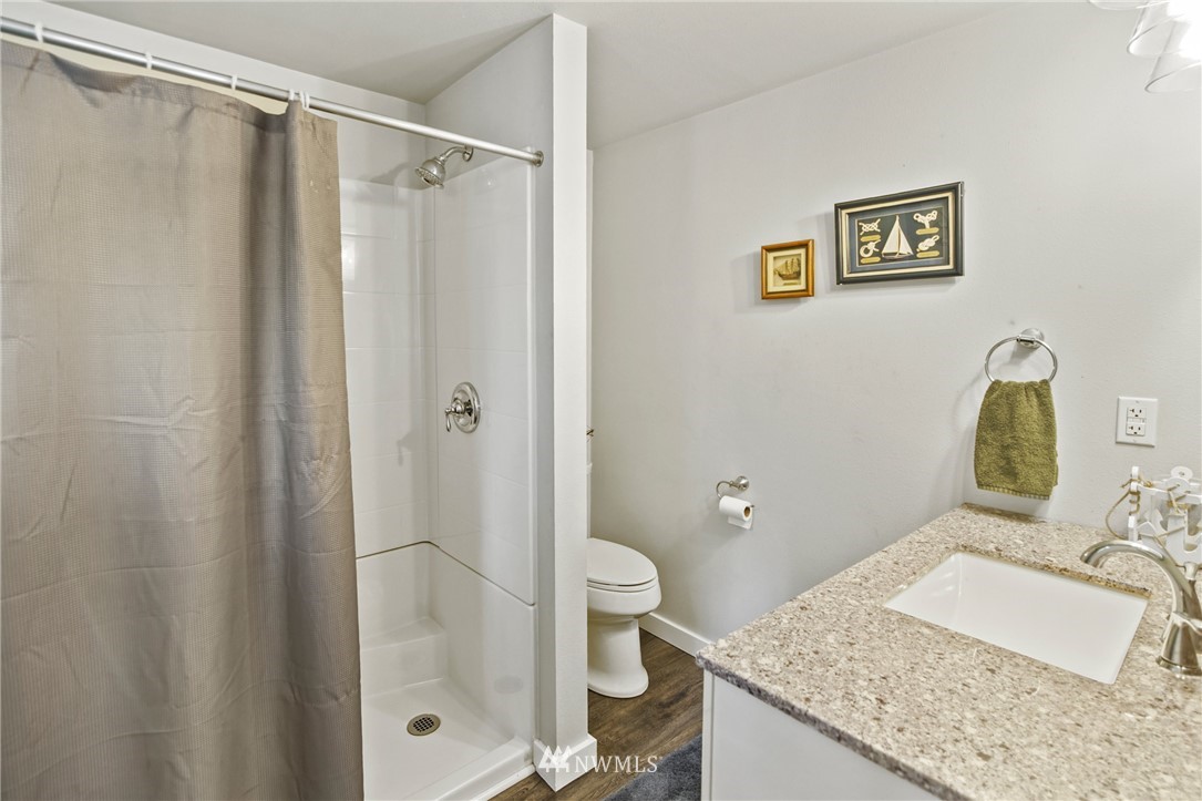 43825 Fir Road Gold Bar, WA 98251 - Photo 22 of 35 a bathroom with a granite countertop sink toilet and shower