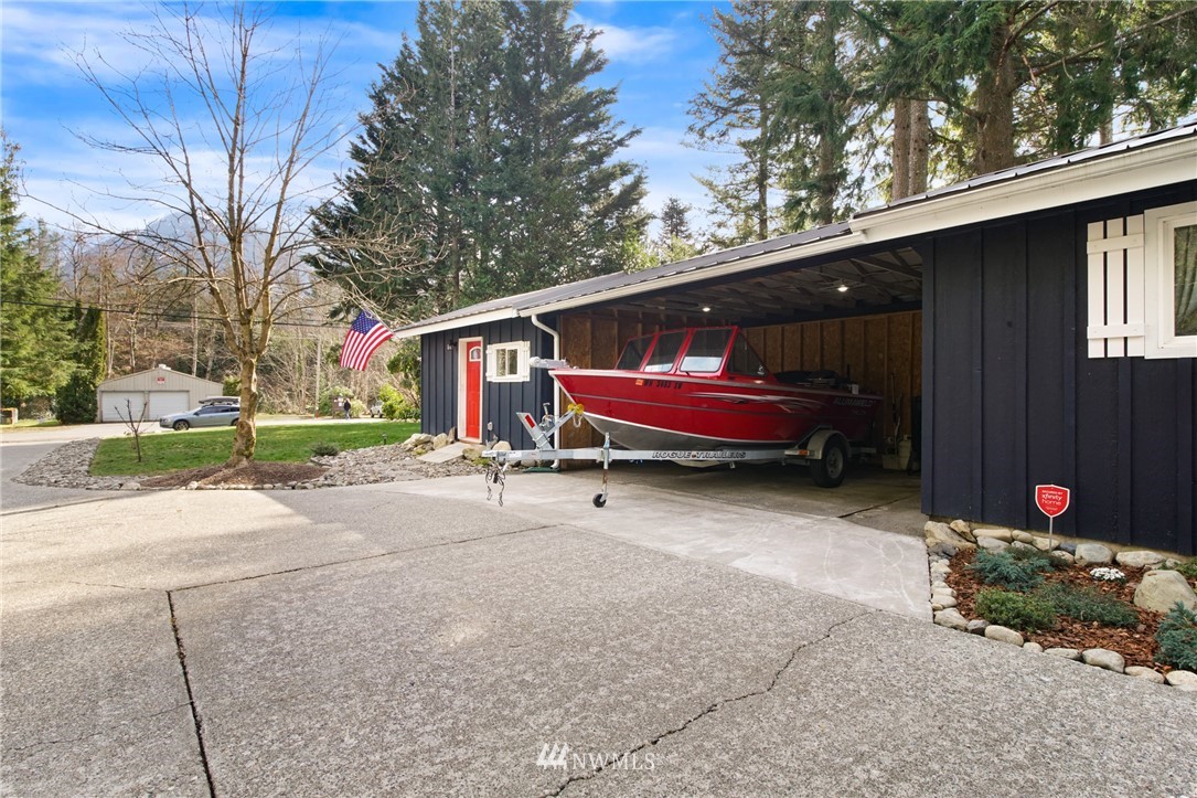 43825 Fir Road Gold Bar, WA 98251 - Photo 30 of 35 a backyard of a house with outdoor seating and trees
