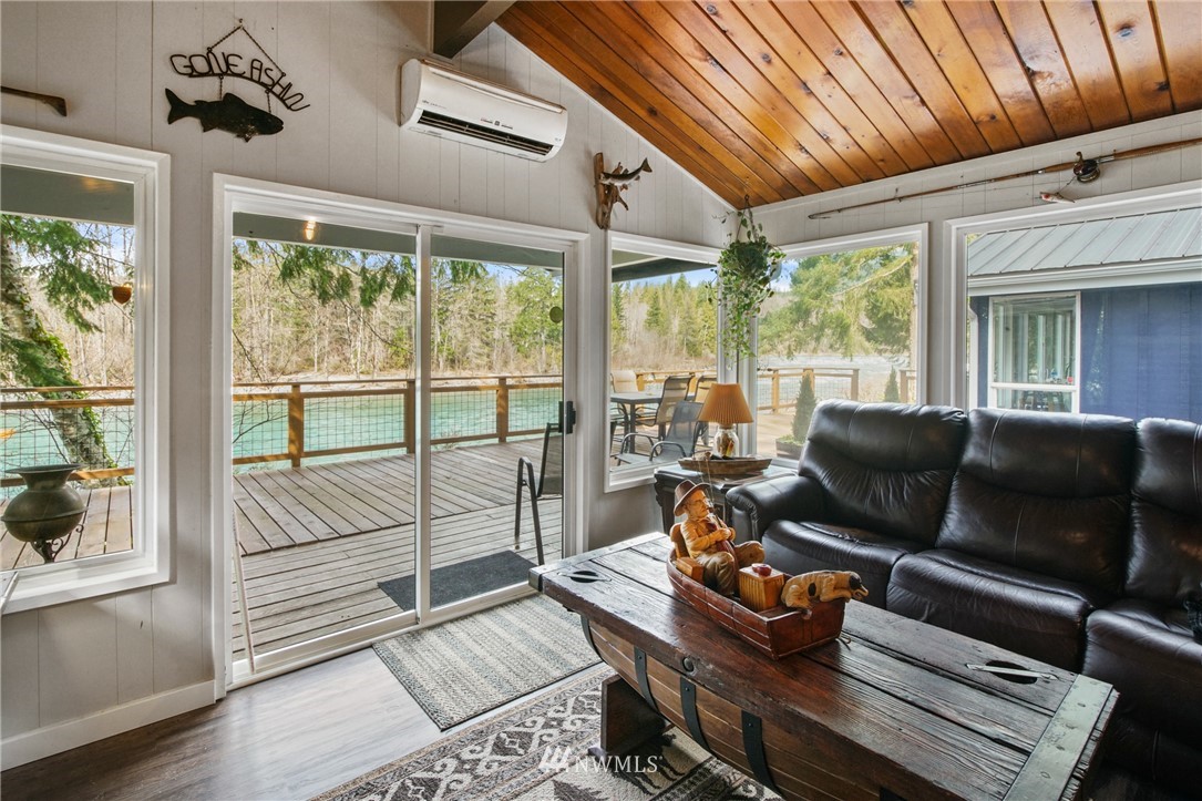 43825 Fir Road Gold Bar, WA 98251 - Photo 5 of 35 a living room with furniture and a floor to ceiling window