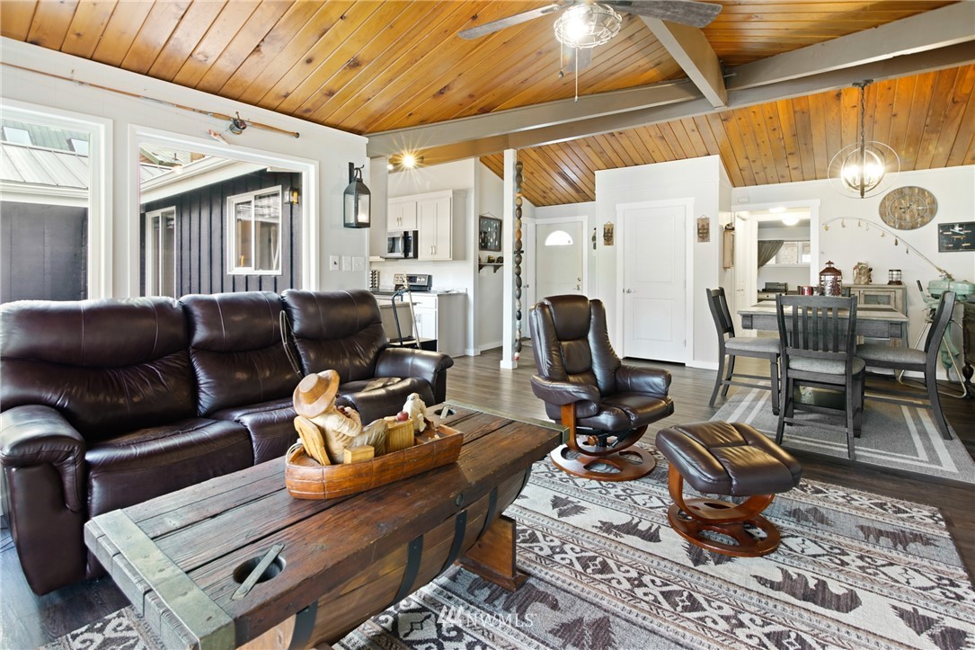 43825 Fir Road Gold Bar, WA 98251 - Photo 8 of 35 a living room with furniture a rug and a window