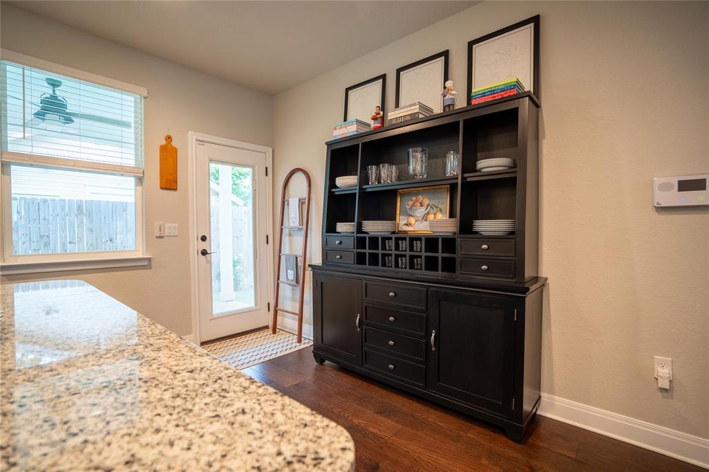 1215 Davis Street Taylor, TX 76574 - Photo 12 of 31 a bed room with a bed and a dresser