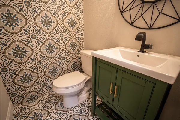 a bathroom with a sink and toilet