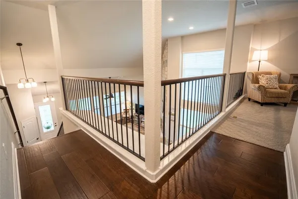 a view of a hallway view with staircase