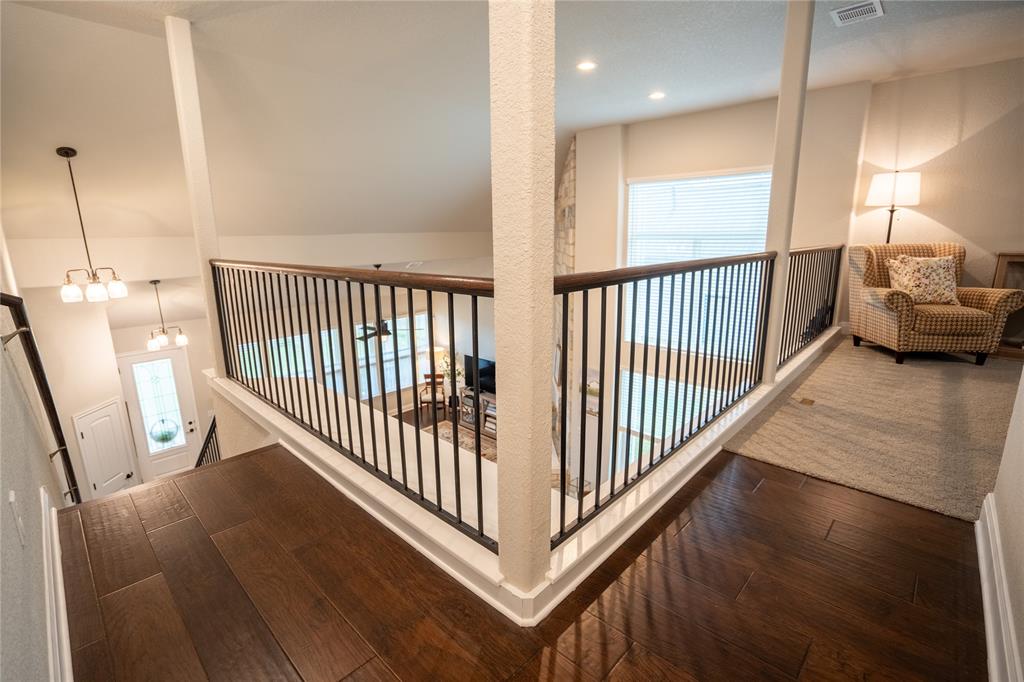 1215 Davis Street Taylor, TX 76574 - Photo 23 of 31 a view of a hallway view with staircase