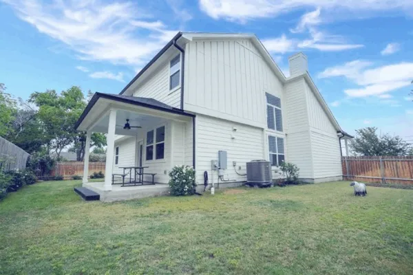 a front view of house with a garden