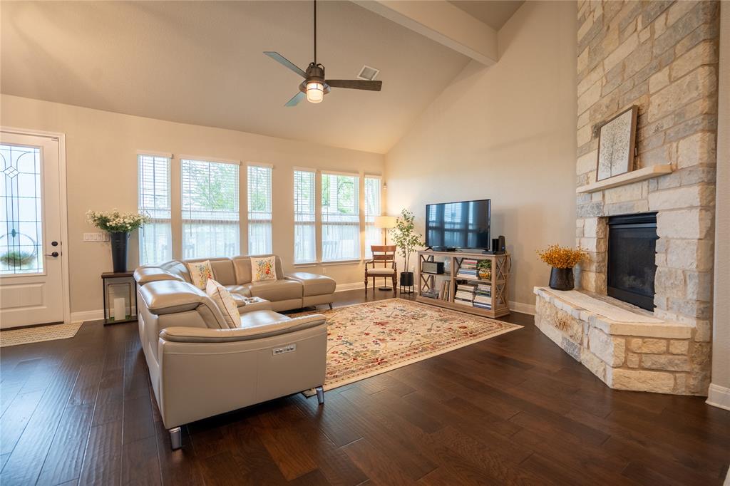 1215 Davis Street Taylor, TX 76574 - Photo 7 of 31 a living room with furniture fireplace and flat screen tv