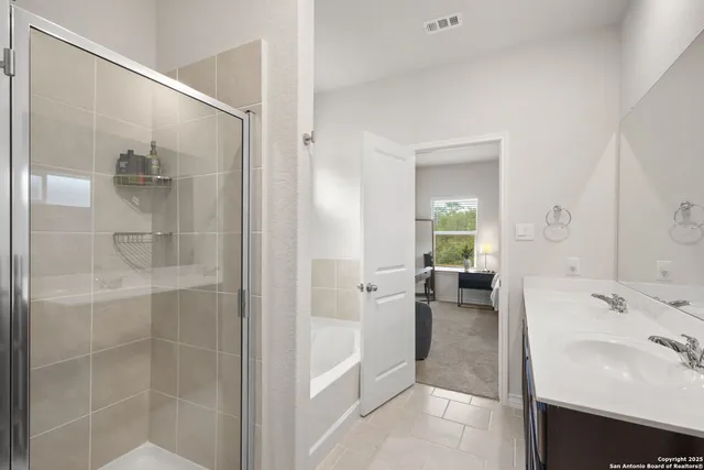 a bathroom with a sink and a shower