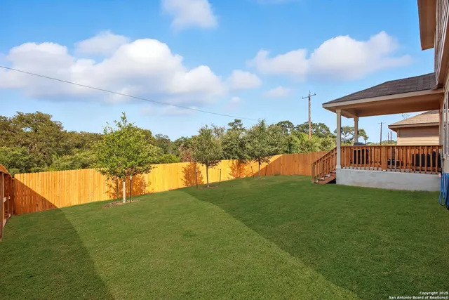 a view of swimming pool with a yard
