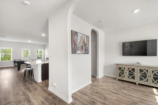 a view of a livingroom with furniture and a flat screen tv