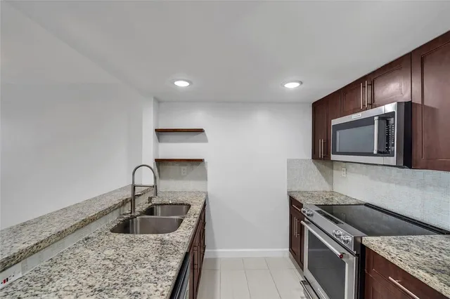 a kitchen with a stove and a microwave