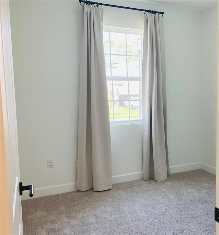 10337 Church Hammock Road Leesburg, FL 34788 - Photo 11 of 21 an empty room with window