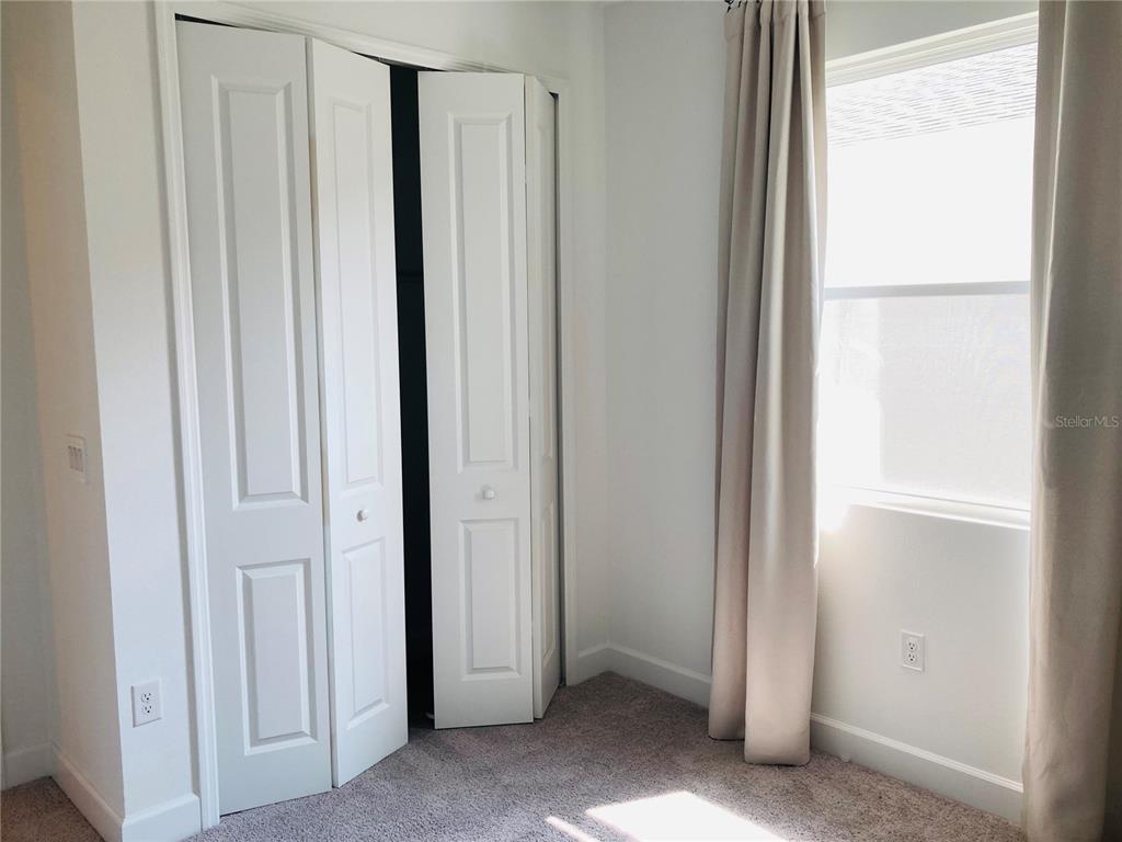 10337 Church Hammock Road Leesburg, FL 34788 - Photo 13 of 21 a view of a closet area with a window