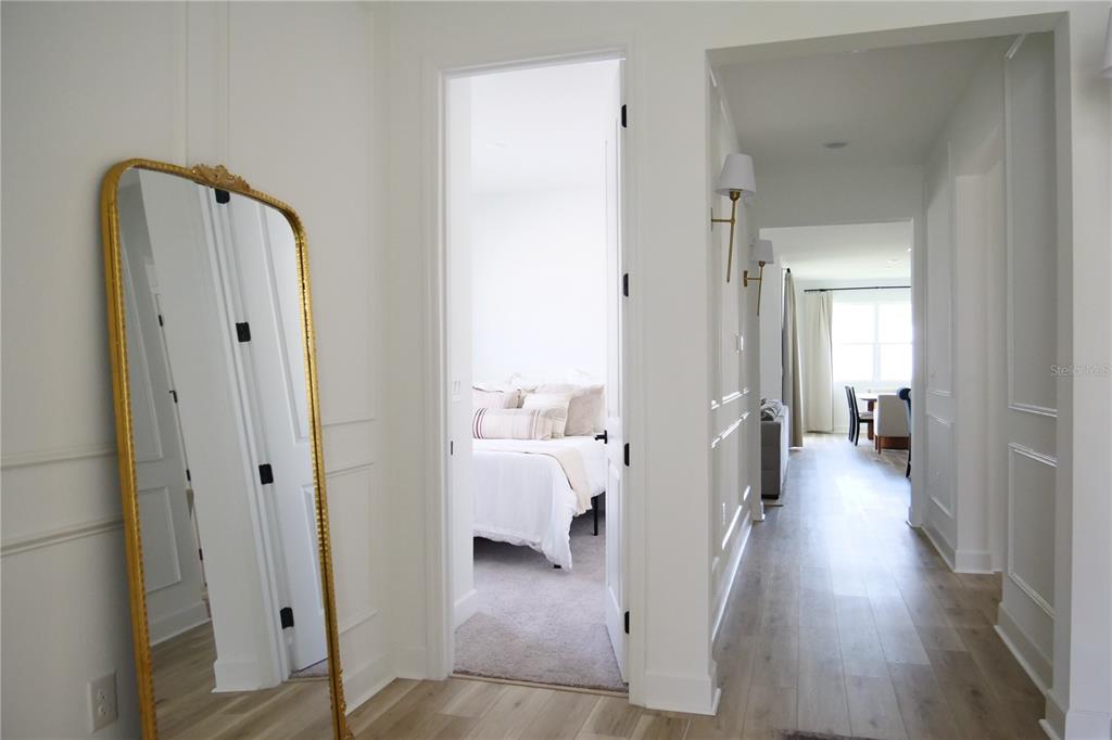 10337 Church Hammock Road Leesburg, FL 34788 - Photo 17 of 21 a view of a hallway with wooden floor and furniture
