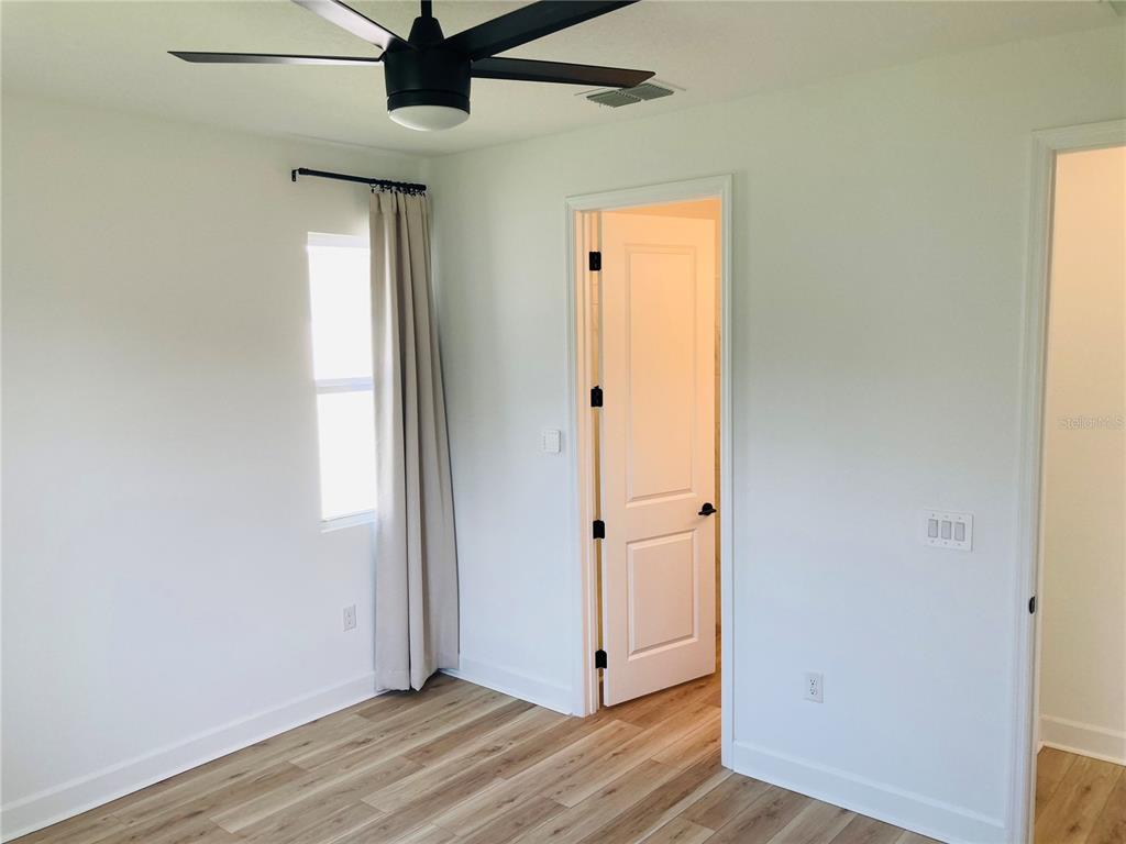 10337 Church Hammock Road Leesburg, FL 34788 - Photo 10 of 21 wooden floor in an empty room