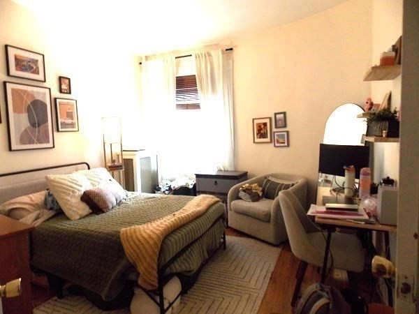 514 Harvard Street, Unit 2D Brookline, MA 02446 - Photo 4 of 11 a bedroom with furniture and a couch