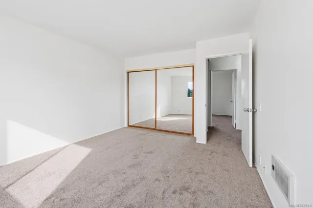 an empty room with a bathroom