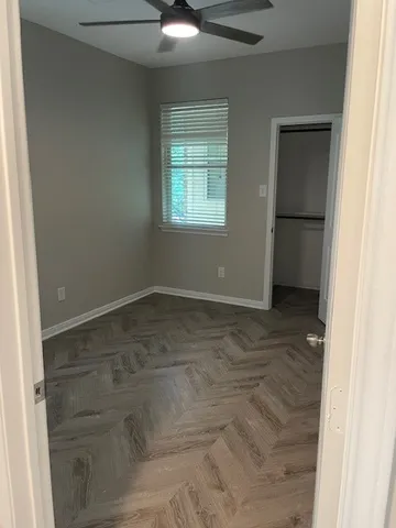 a view of an empty room with a window