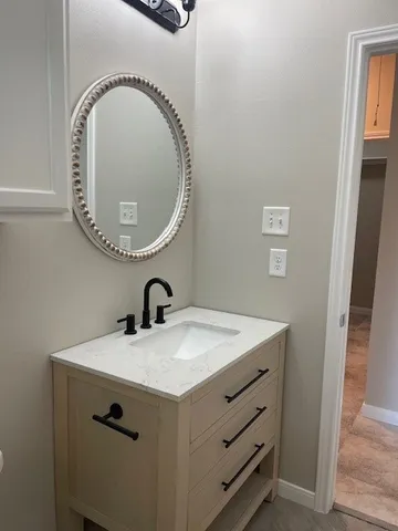 a bathroom with a sink and a vanity