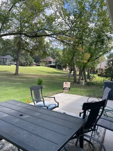 a view of a lake with outdoor seating