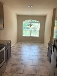 a view of a kitchen with a sink wooden floor and a window