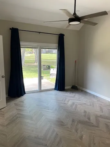 a view of an empty room with a window