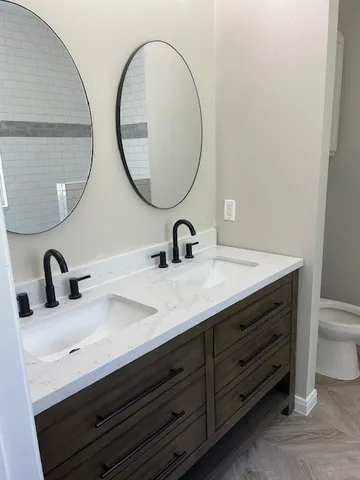 a bathroom with a sink and a mirror