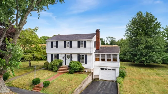 a view of house with swimming pool outdoor seating