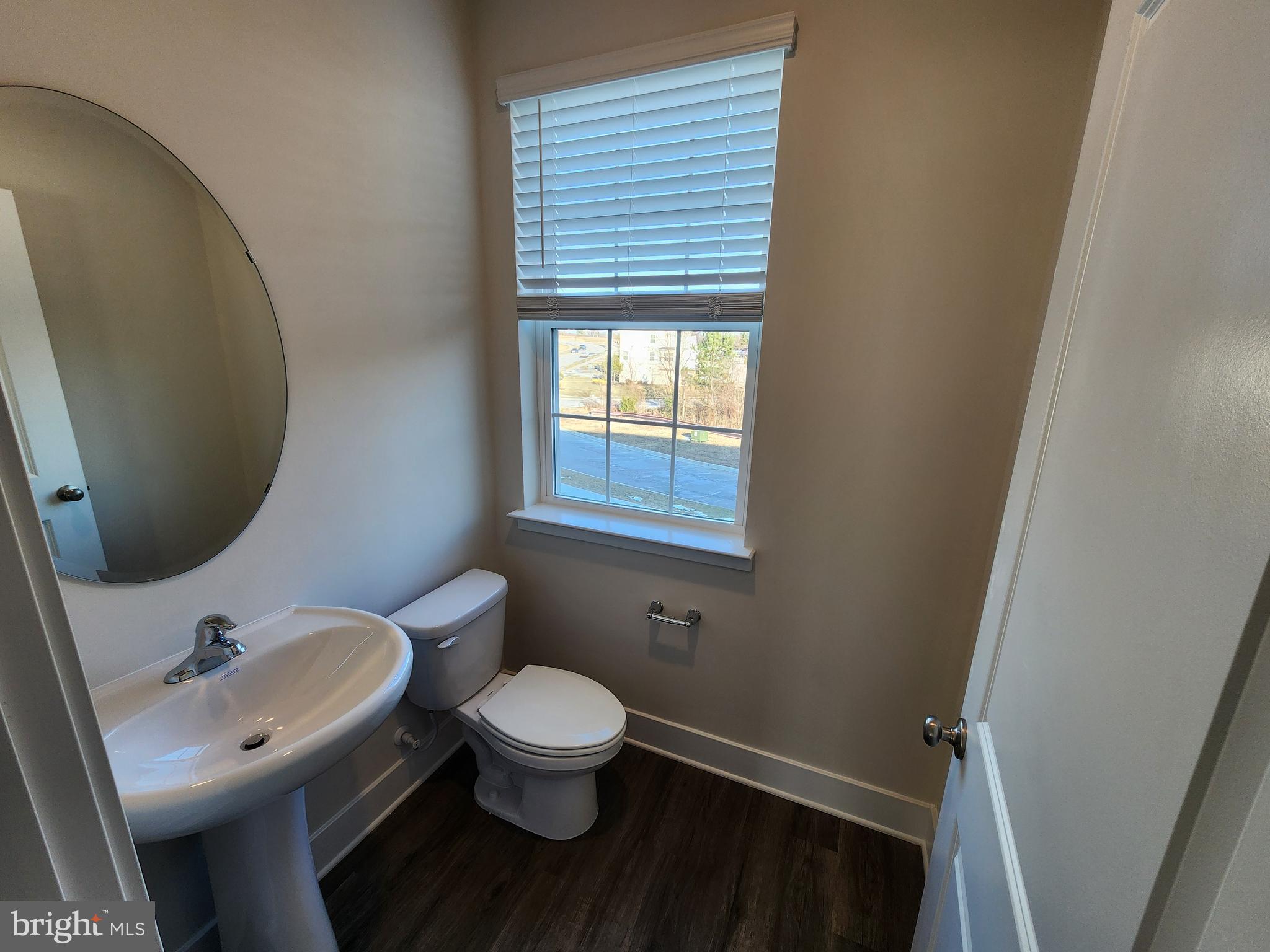 213 Joppa Farm Road Joppa, MD 21085 - Photo 11 of 22 a bathroom with a toilet sink and mirror