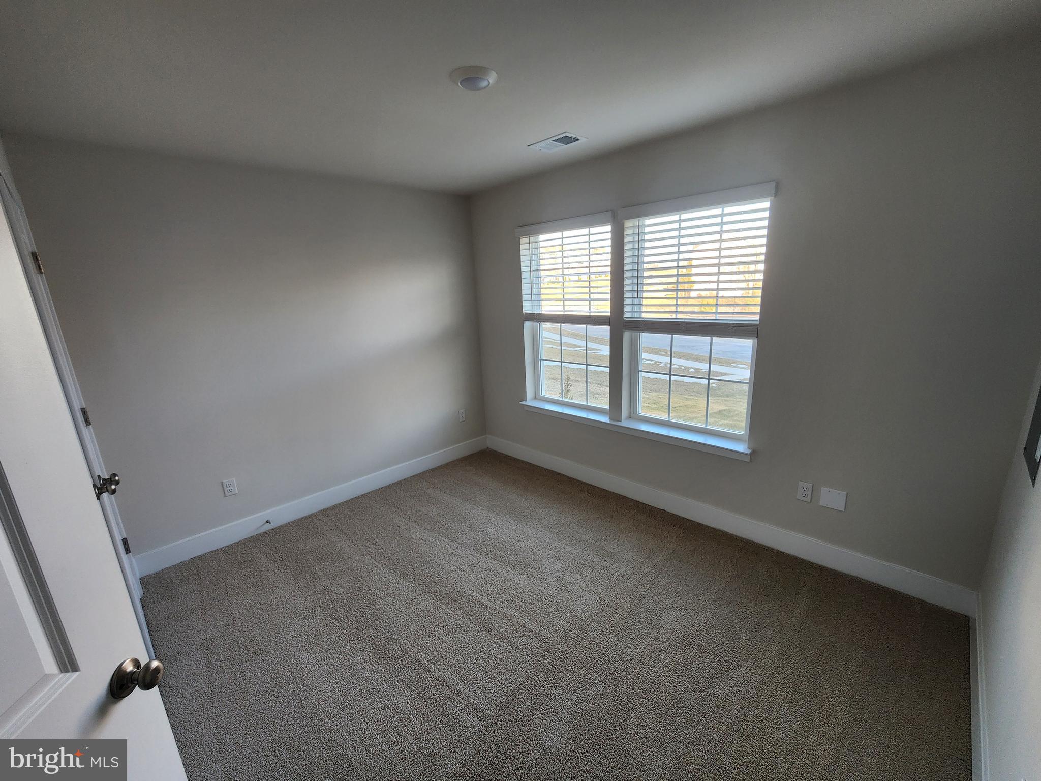 213 Joppa Farm Road Joppa, MD 21085 - Photo 4 of 22 an empty room with windows