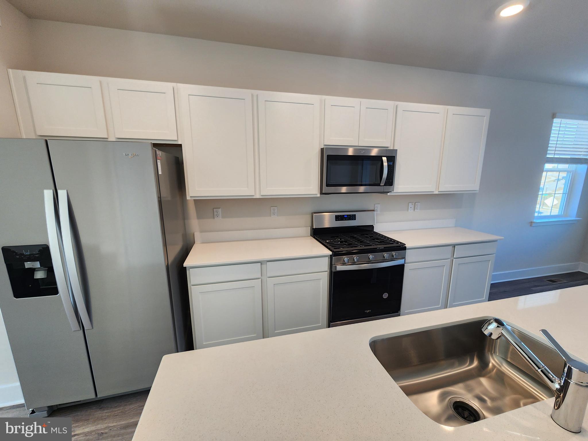 213 Joppa Farm Road Joppa, MD 21085 - Photo 6 of 22 a kitchen with a refrigerator sink and stove
