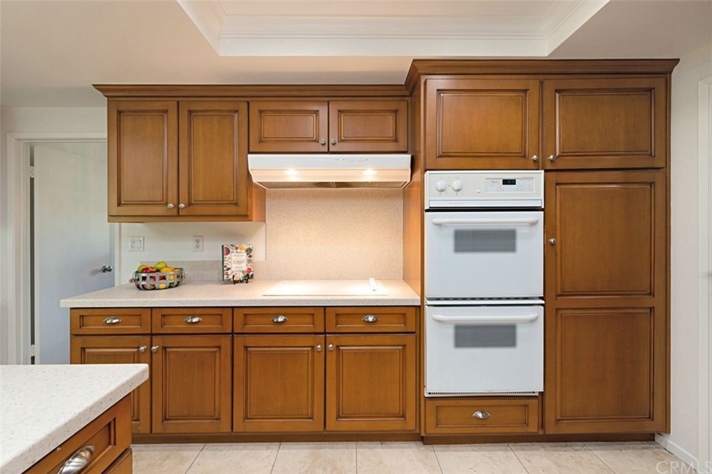 11 Jetty Drive Corona del Mar, CA 92625 - Photo 12 of 44 a kitchen with stainless steel appliances granite countertop a refrigerator and a stove