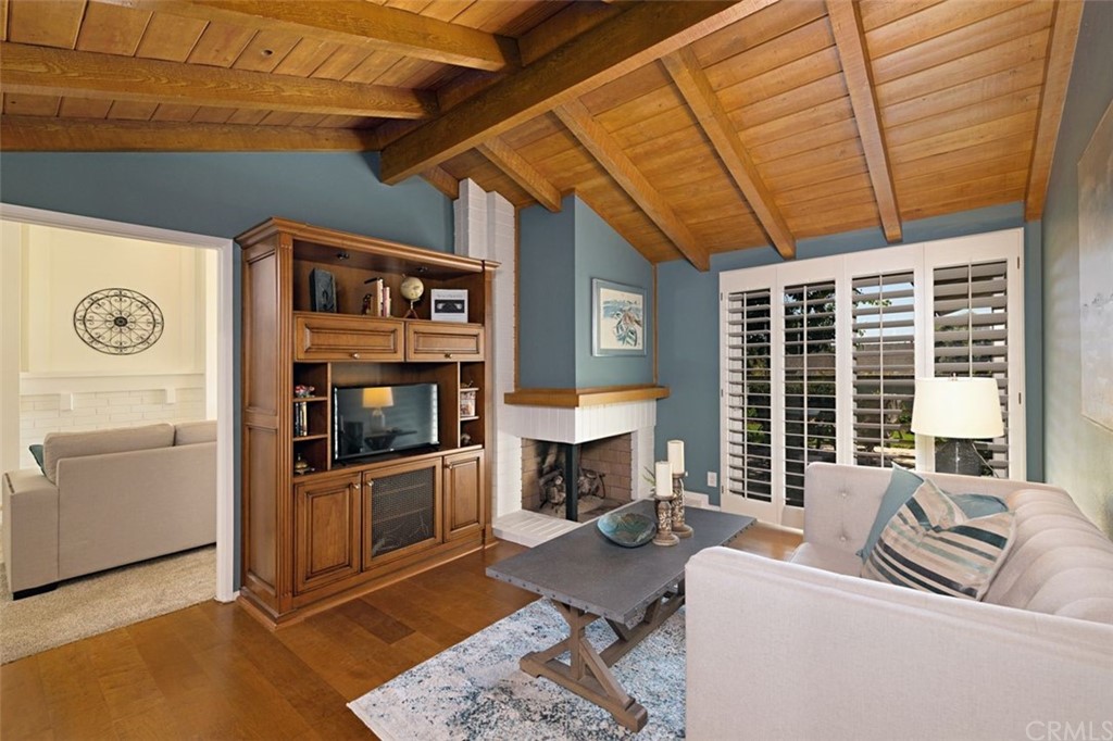 11 Jetty Drive Corona del Mar, CA 92625 - Photo 15 of 44 a living room with furniture and a fireplace