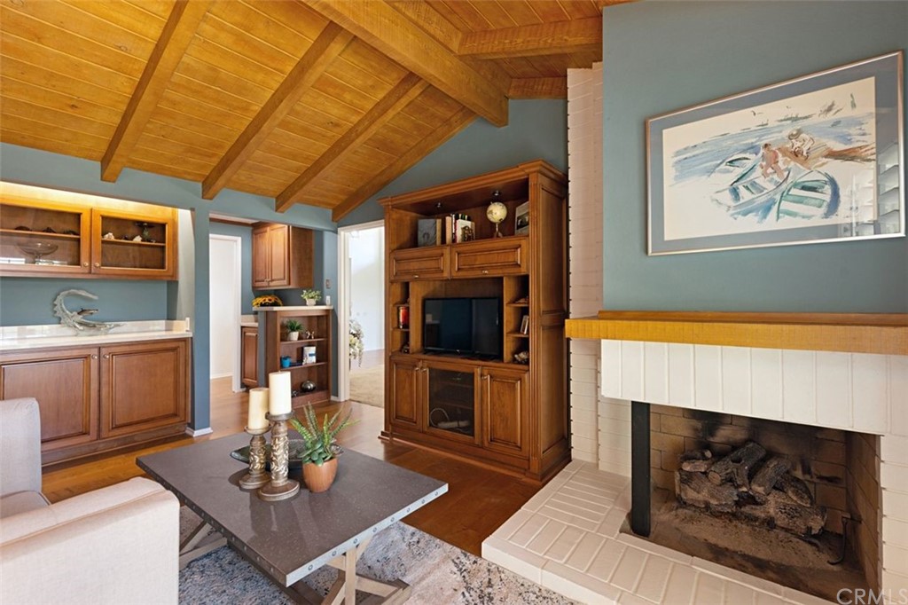 11 Jetty Drive Corona del Mar, CA 92625 - Photo 16 of 44 a living room with furniture and a fireplace