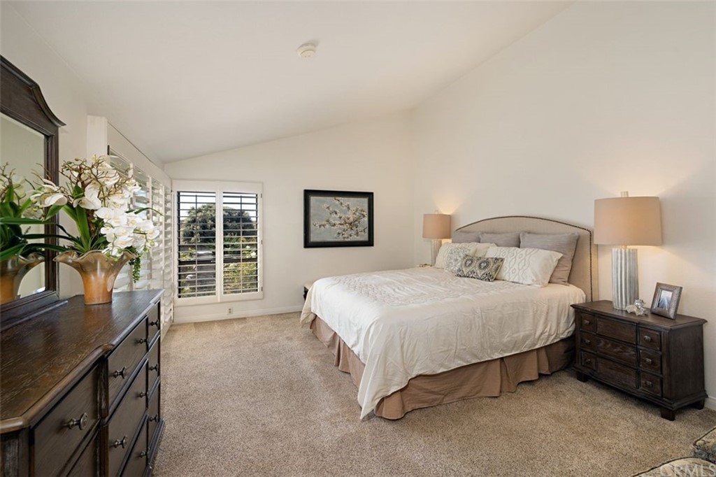 11 Jetty Drive Corona del Mar, CA 92625 - Photo 20 of 44 a bedroom with a bed and a large window