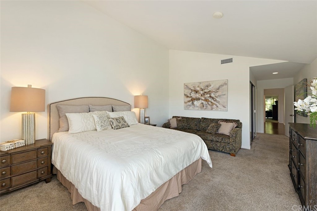 11 Jetty Drive Corona del Mar, CA 92625 - Photo 21 of 44 a bedroom with a large bed and a couch
