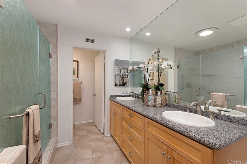 11 Jetty Drive Corona del Mar, CA 92625 - Photo 24 of 44 a bathroom with a granite countertop sink and a mirror