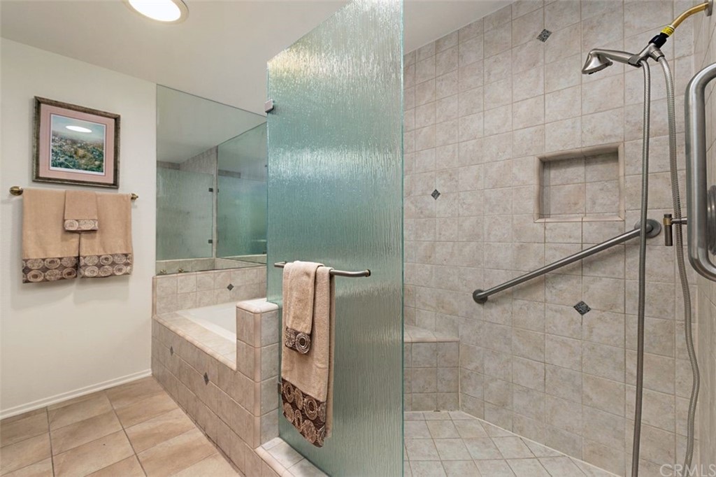 11 Jetty Drive Corona del Mar, CA 92625 - Photo 25 of 44 a bathroom with a bathtub and shower