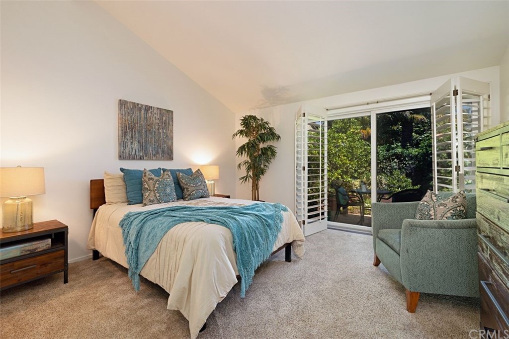 11 Jetty Drive Corona del Mar, CA 92625 - Photo 26 of 44 a spacious bedroom with a bed and a couch